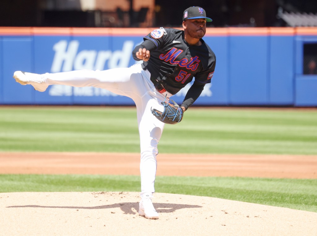 New York Mets pitcher Freddy Peralta (51) pitching in a baseball game.