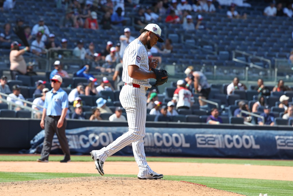 New York Yankees pitcher Camilo Doval (75) reacts after Minnesota Twins designated hitter Josh Bell (56) hits a two-run home run.