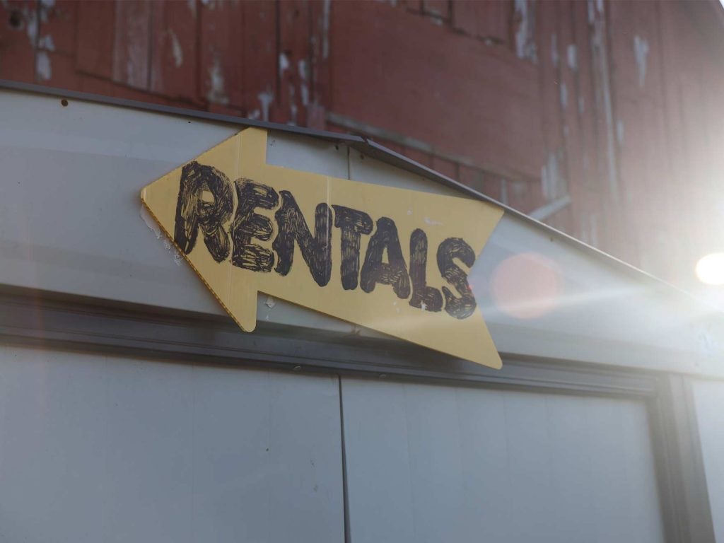 A "rentals" sign handwritten on an arrow.
