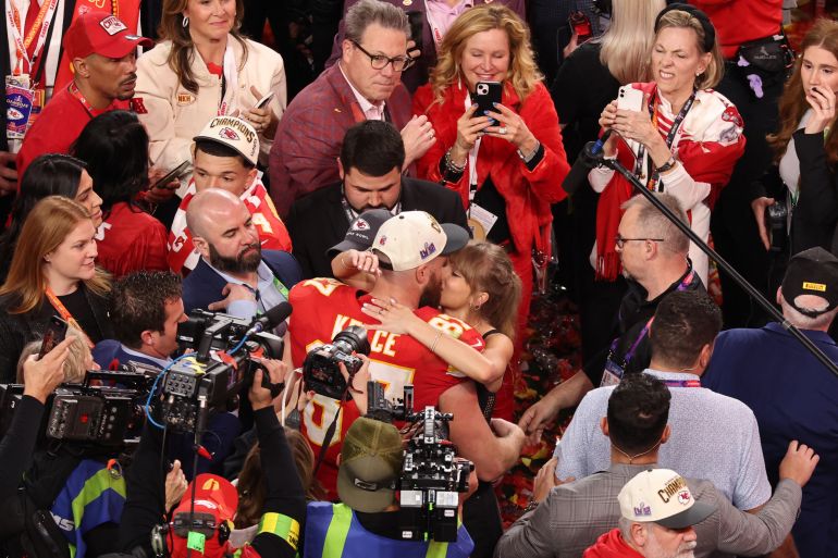 Football - NFL - Super Bowl LVIII - Kansas City Chiefs v San Francisco 49ers - Allegiant Stadium, Las Vegas, Nevada, United States - February 11, 2024 Kansas City Chiefs' Travis Kelce kisses partner Taylor Swift as they celebrate after Kansas City Chiefs win Super Bowl LVIII REUTERS/Mike Blake