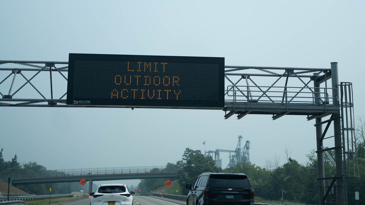 Smoke in the air keeps many indoors, but some still outside