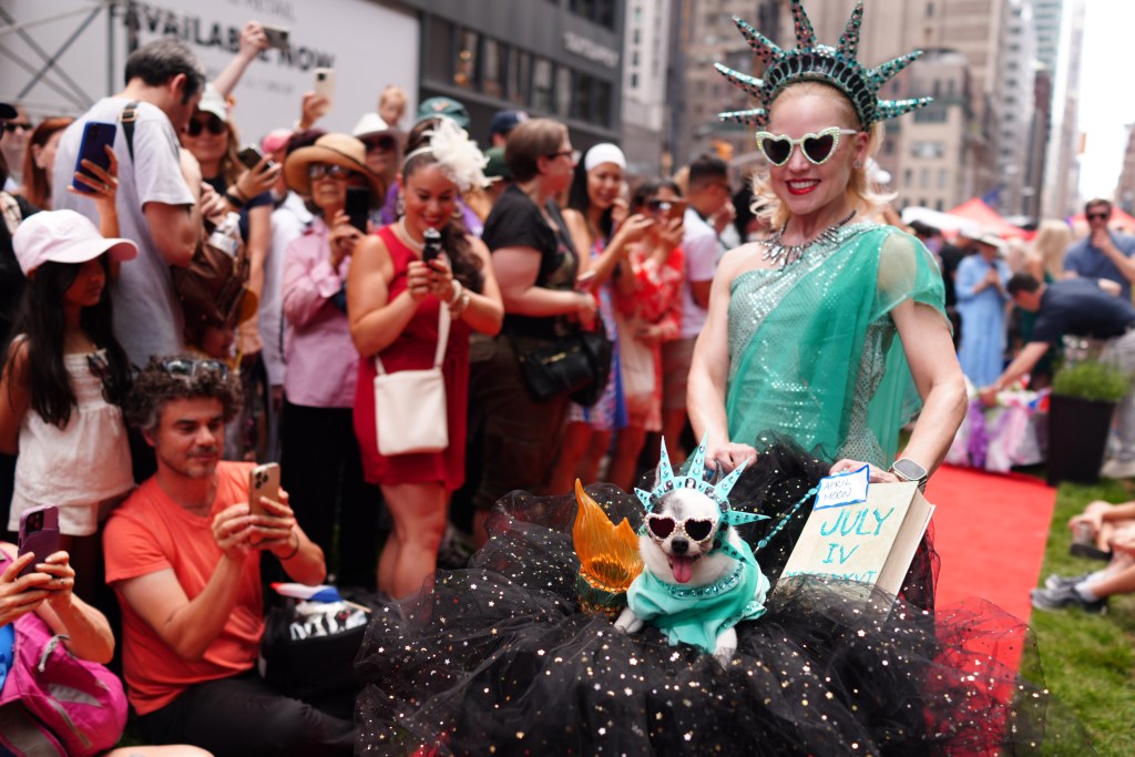 Summer Sparkles and her Chihuahua Liberty after winning the New York Dog Parade contest during L'Alliance New York's annual Bastille Day celebration on Madison Avenue in New York. 