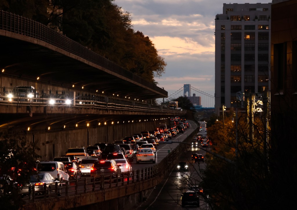  Traffic moves along the Brooklyn Queens Expressway below the Brooklyn Promenade on October 26, 2025