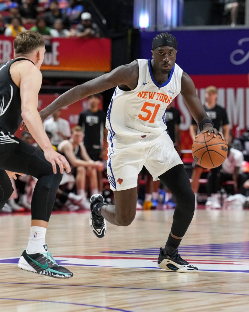 Mohamed Diawara of the New York Knicks dribbles the basketball while playing against the Brooklyn Nets.