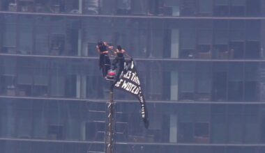 Empire State Building proposal: People climb spire to raise flag; propose at top