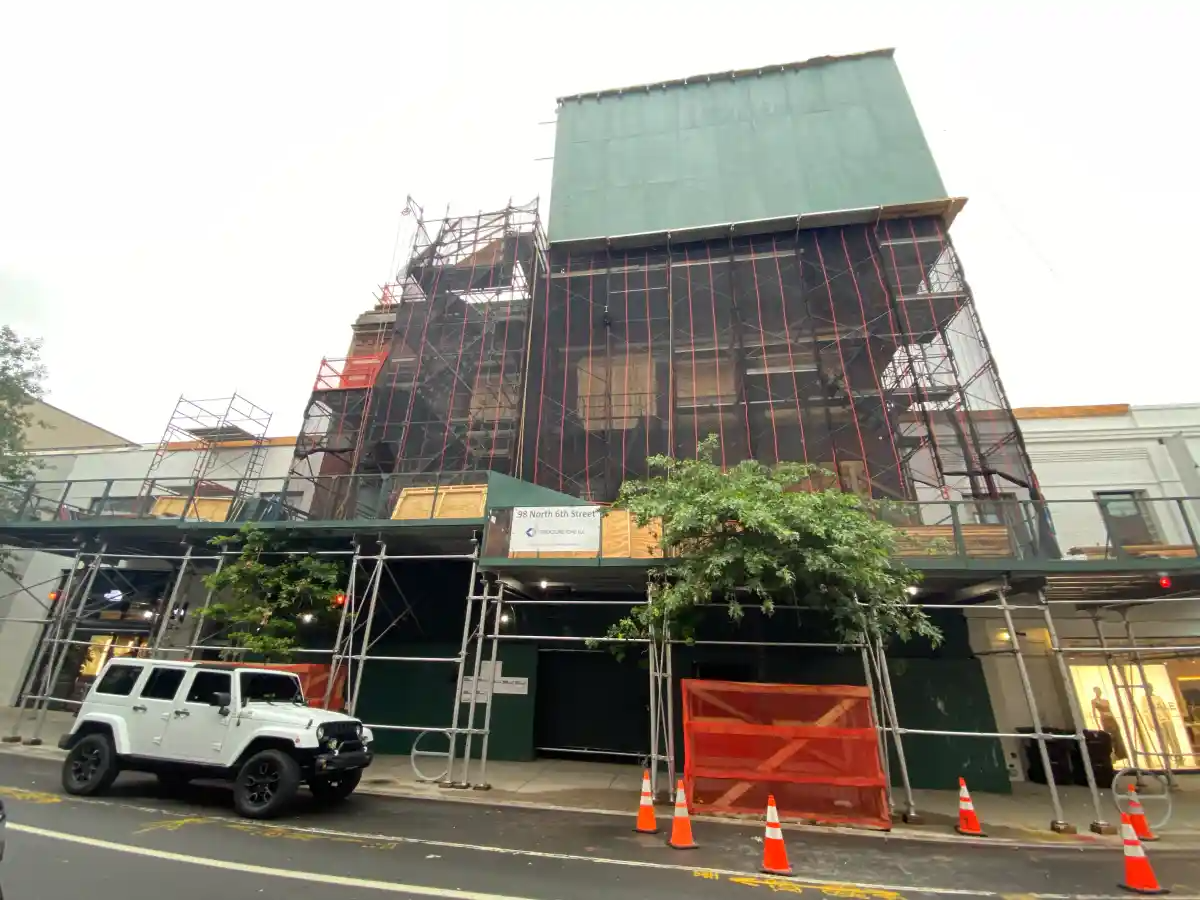 scaffolding covered building in williamsburg