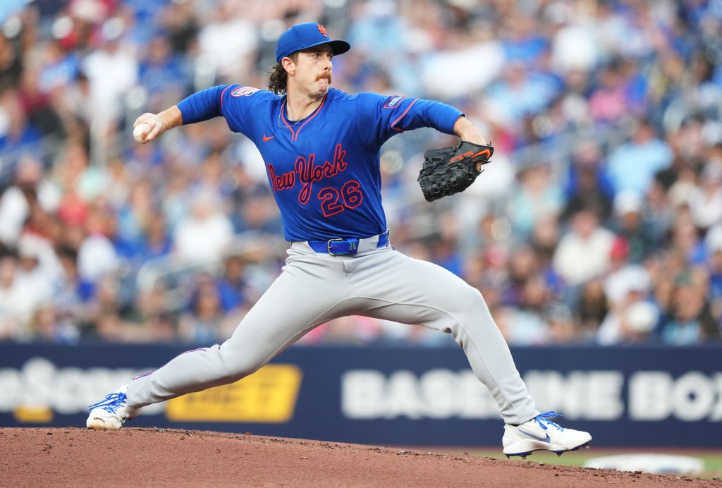 New York Mets pitcher Nolan McLean pitching during a game.