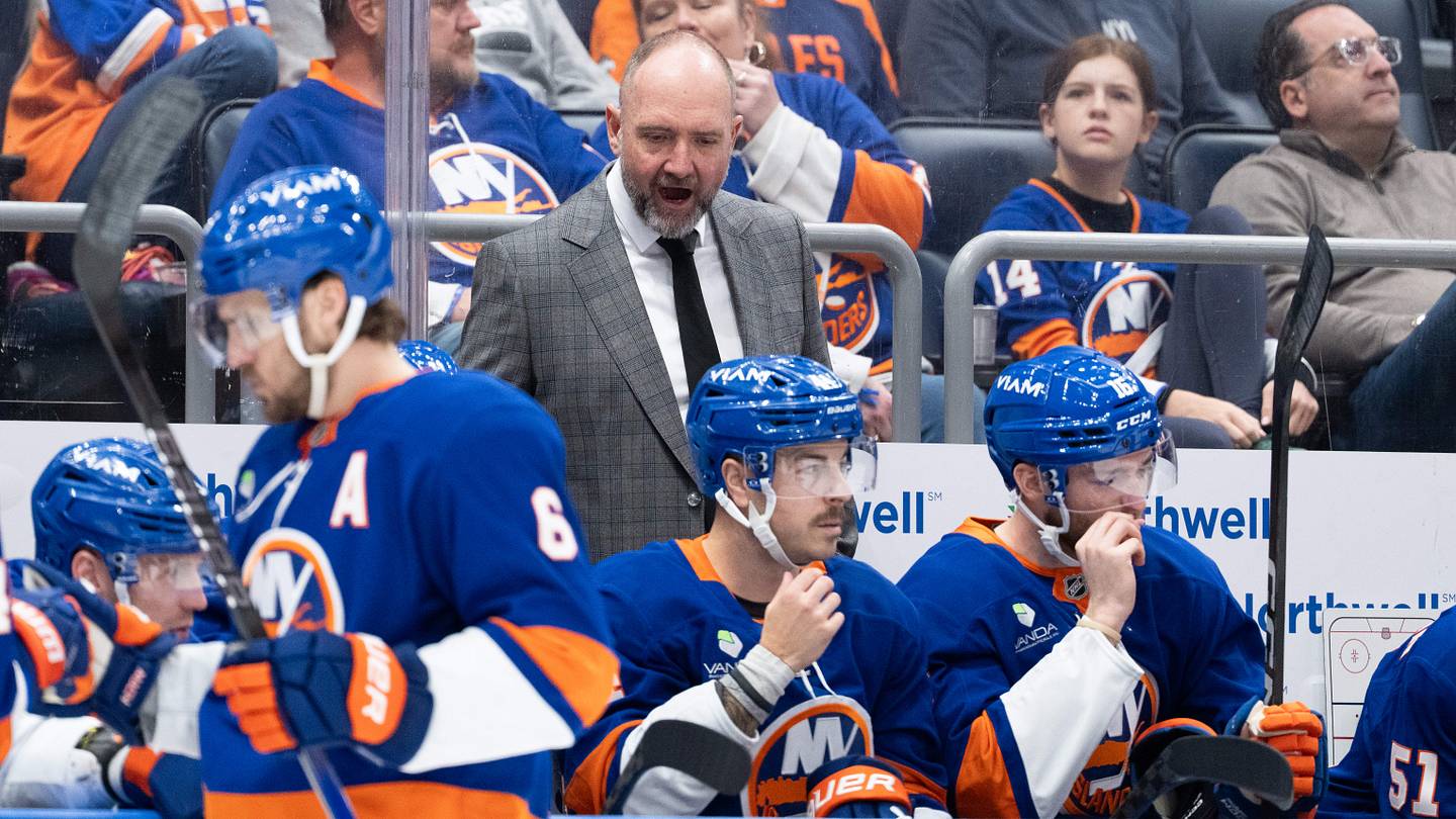 New York Islanders head coach Peter DeBoer speaks to his team prior to their game against the Montréal Canadiens at UBS Arena. Mandatory Credit: Alexander Wohl-Imagn Images