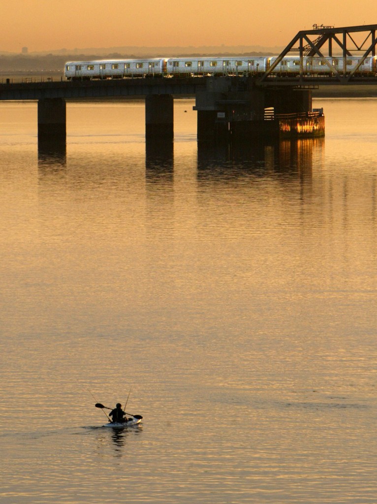 A kayaker paddles in Jamaica Bay,