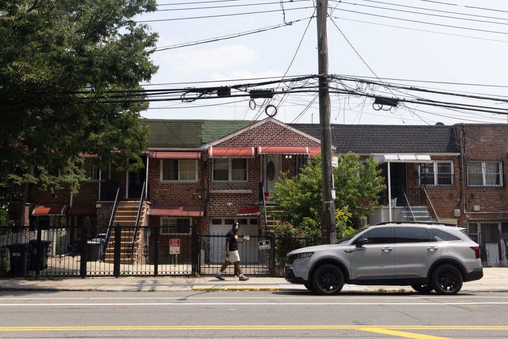 Residential townhouses line blocks around East Gun Hill Road in The Bronx.