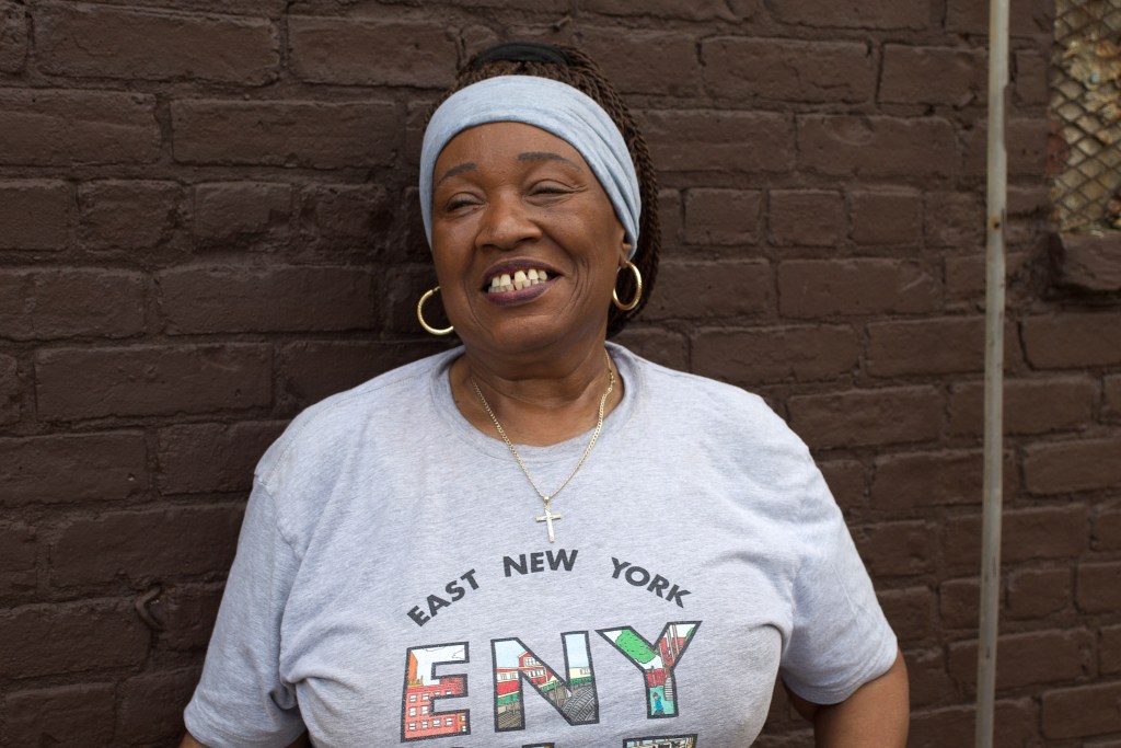 East New York Community Land Trust Special Projects Coordinator Debra Ack stands next to the nonprofit’s new headquarters,