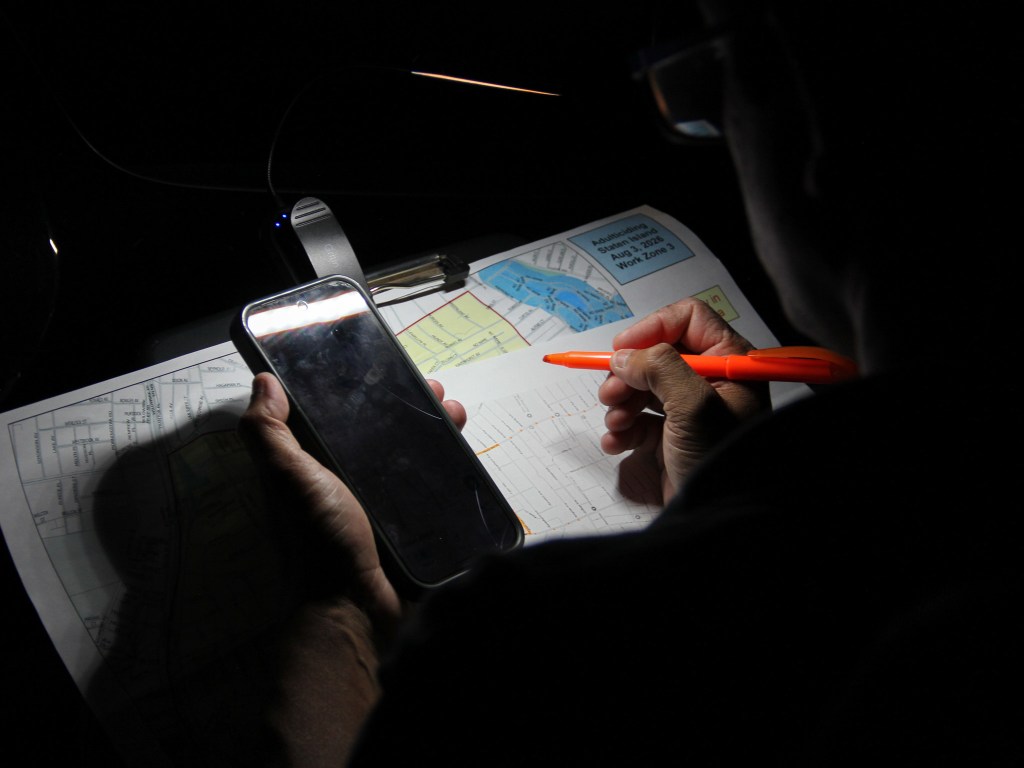 Department of Health employee Hamim Riaj navigates a mosquito spray route on Staten Island,