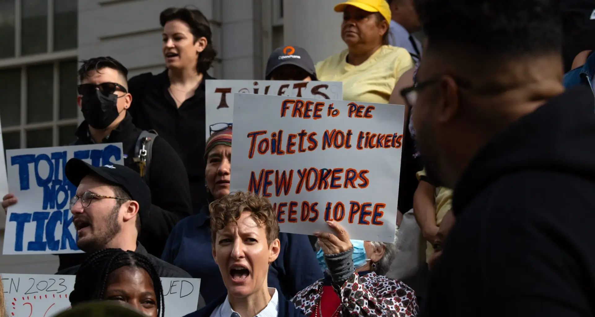 Homeless rights and community advocates rally on the steps of City Hall in favor of a pair of bills to increase the number of publicly accessible bathrooms across the five boroughs, Sept. 19, 2024. Credit: Ben Fractenberg/THE CITY