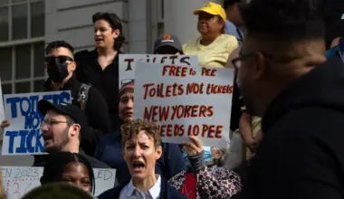 Homeless rights and community advocates rally on the steps of City Hall in favor of a pair of bills to increase the number of publicly accessible bathrooms across the five boroughs, Sept. 19, 2024. Credit: Ben Fractenberg/THE CITY