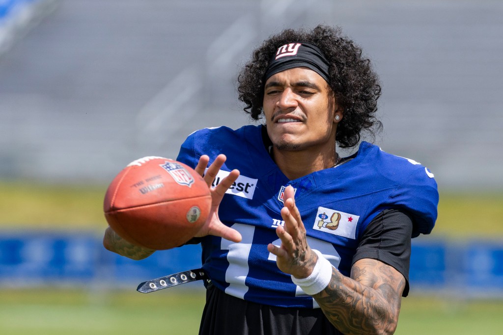 New York Giants wide receiver Jalin Hyatt catching a football during training camp.