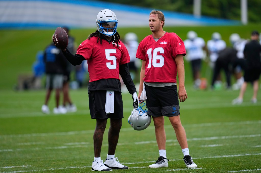 Detroit Lions quarterbacks Teddy Bridgewater (5) and Jared Goff (16) talk during practice at the NFL football team's training camp in Allen Park, Mich., Sunday, Aug. 2, 2026.