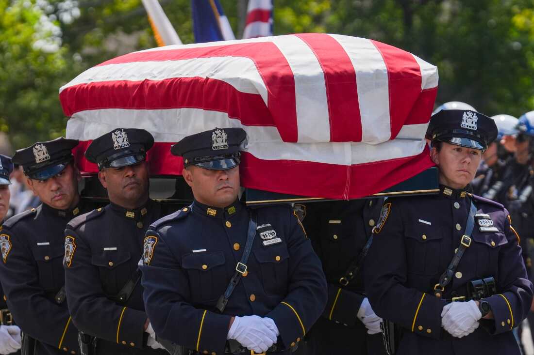 The casket of Staff Sgt. Angel S. Rampersad, who was killed in the ongoing war between the U.S. and Iran, is carried by NYPD officers during the funeral procession in New York on Friday, July 31.