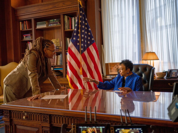 This image released by Netflix shows director Ava DuVernay, left, with 14th librarian of Congress, Carla Hayden, during the filming of the documentary “14th" about the 14th amendment, which gave liberty and rights to formerly enslaved people following the Civil War. (Paul Garnes/Netflix via AP)