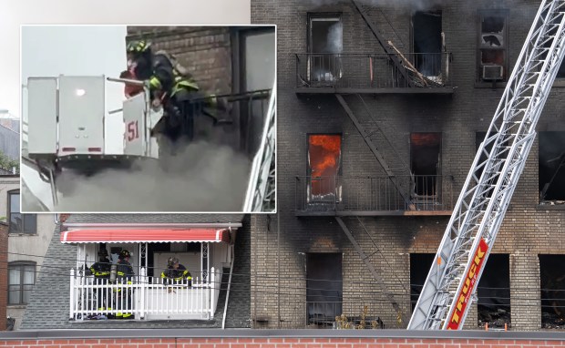 An FDNY firefighter rescues a child (inset) during a massive Bronx fire in a five-story apartment building in Norwood on E. 209th St. near Parkside Place in the Bronx on Wednesday, Aug. 5, 2026. (Barry Williams/ New York Daily News; Obtained by NYDN)