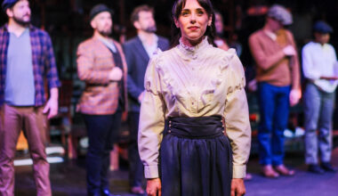 actor attired as Emily Roebling on stage