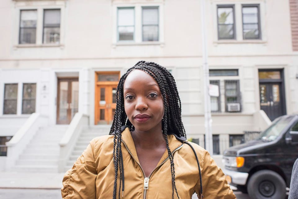 Young young woman in her city neighborhood
