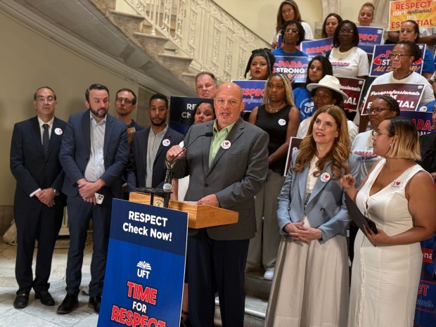 UFT President Michael Mulgrew speaks at a press conference at City Hall last month in support of $10,000 checks for public school paraprofessionals.