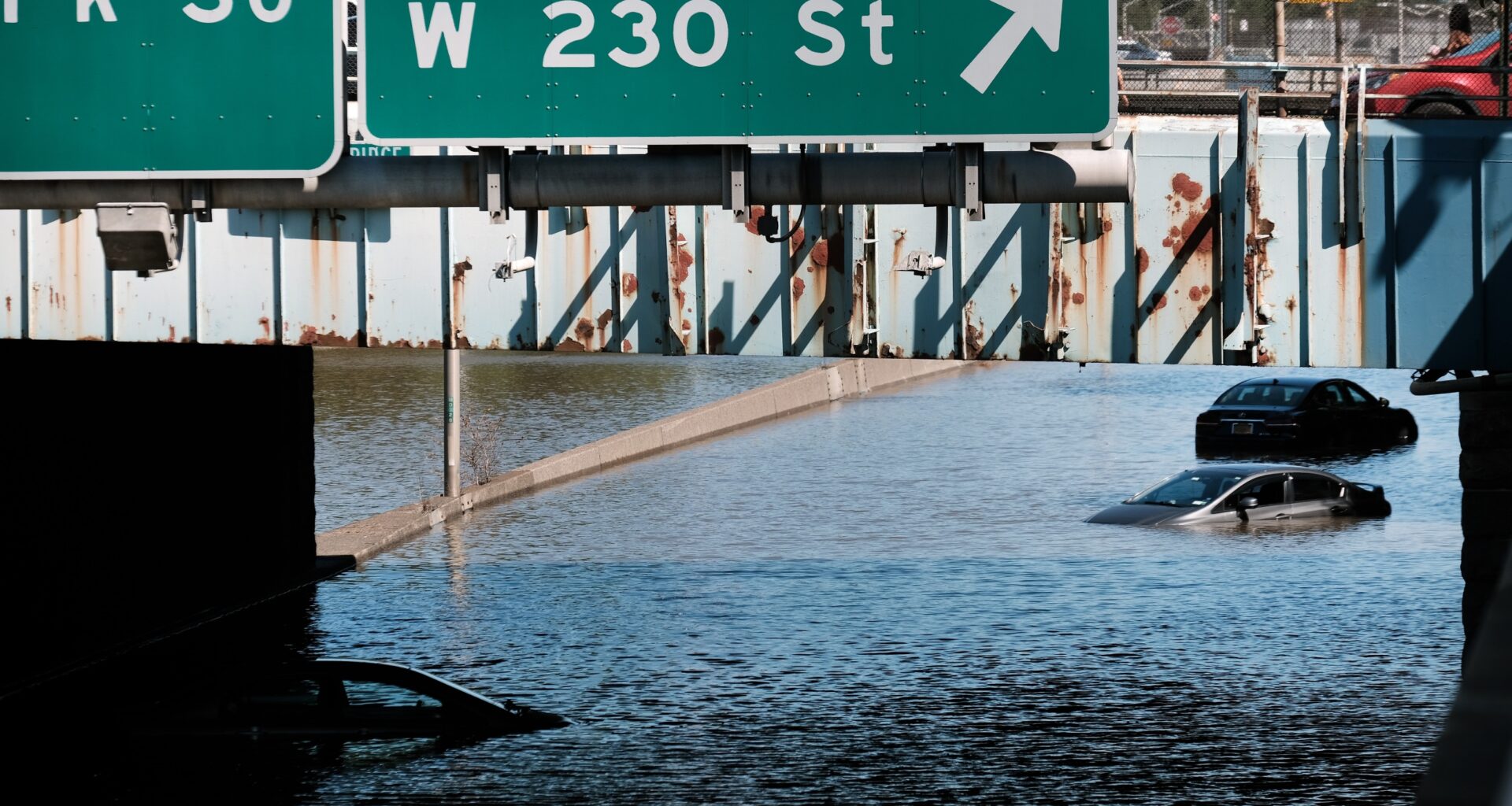 Cars sit abandoned flooded Major Deegan Expressway