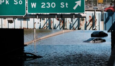 Cars sit abandoned flooded Major Deegan Expressway
