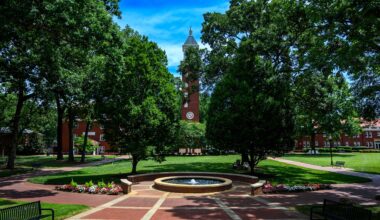 A photo of the Evans Clock Tower in the residential quad of the Queens campus.