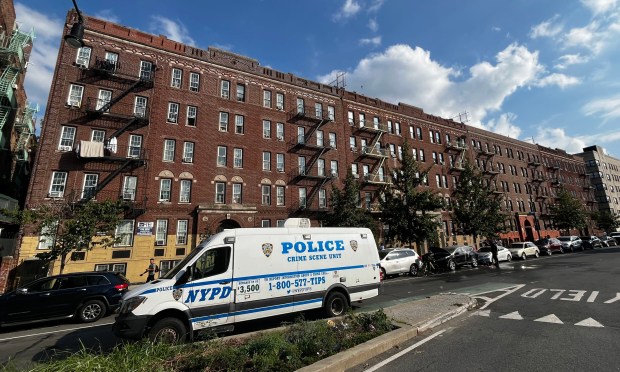 An NYPD Crime Scene Unit vehicle outside an apartment building on Grand Concourse near E. 168th St. in the Bronx after Josefa Soto de Guzman was found dead on Aug. 22.
