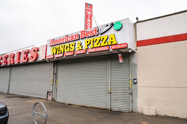 A 44-year-old man was shot in the head and a 39-year-old man was blasted in the right leg inside American Best Wings & Pizza in Brownsville moments after midnight, cops said. (Theodore Parisienne / New York Daily News)