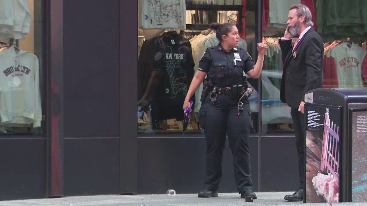 Knife-wielding woman accused of stabbing 2 in Times Square shot by police