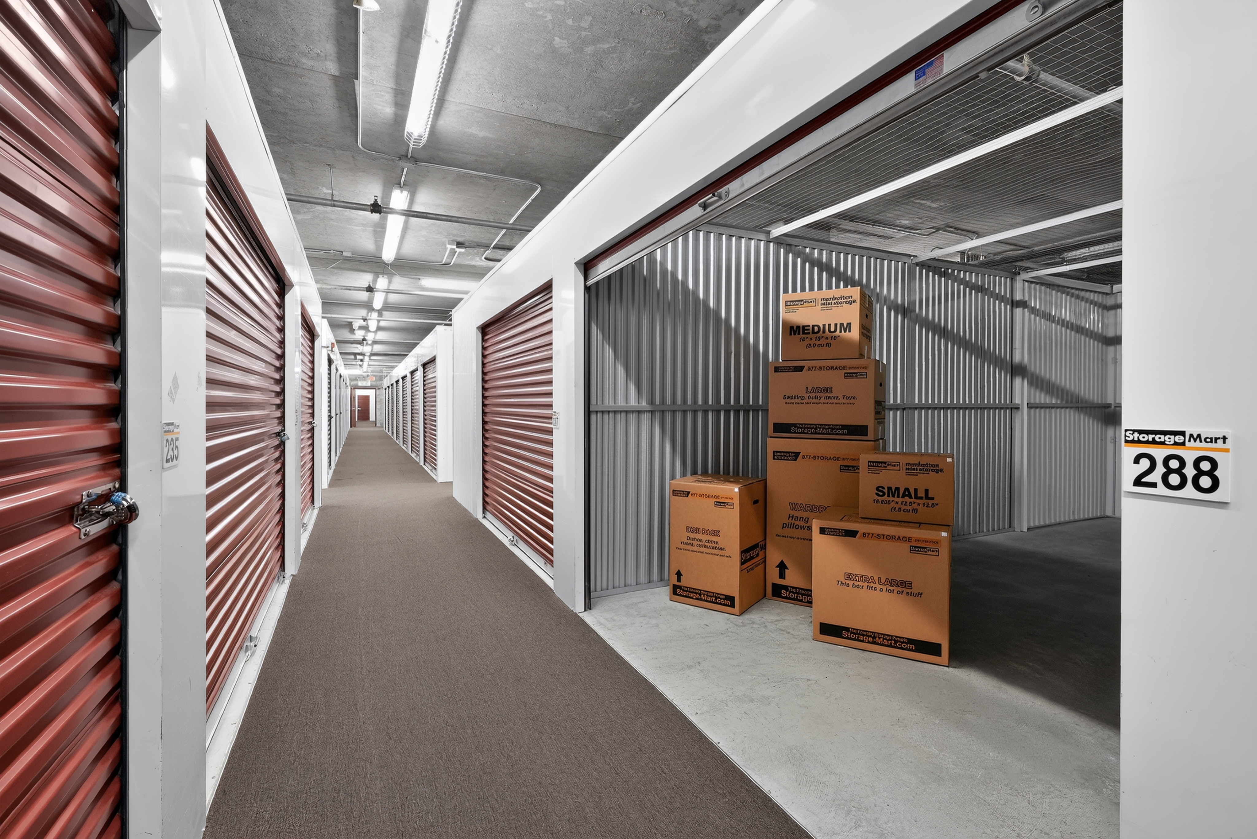 storage boxes stacked in an open, indoor storage unit