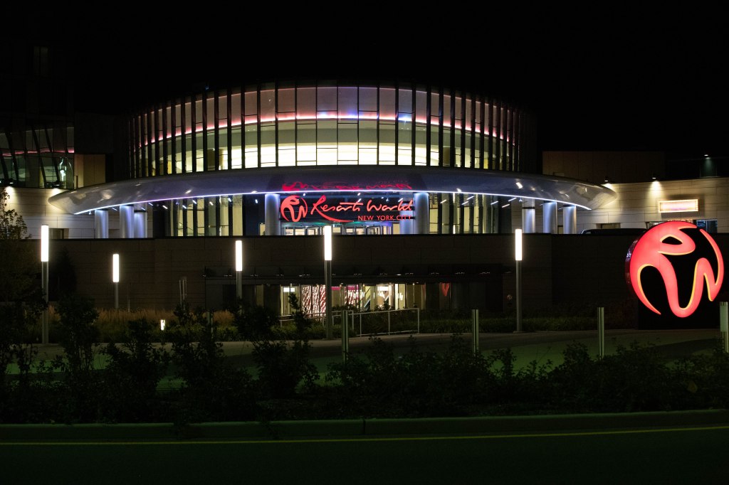 The brightly lit Resorts World Casino at night.