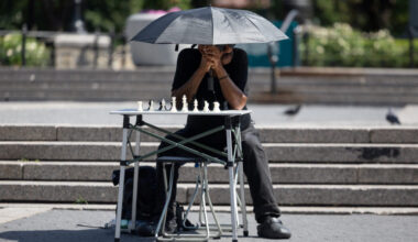 A man waits to play chess during a heatwave in New York City