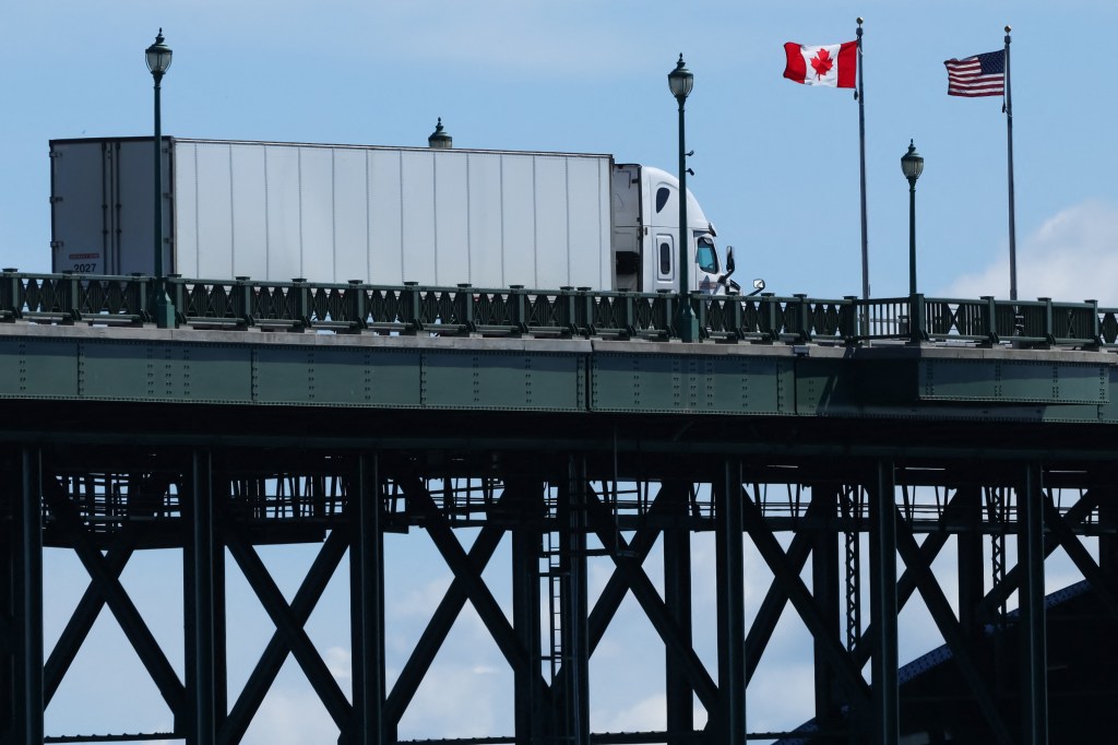 A truck passes over the Peace Bridge from Buffalo, New York, into Canada.