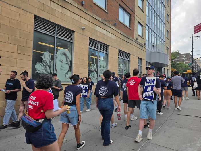 Bronx Defenders attorneys and staff form a picket outside of their South Bronx office.