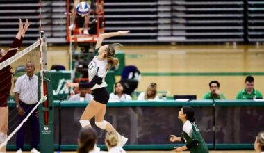 Abby Morreale, #11, who led her team last season in blocks, goes in for the kill.