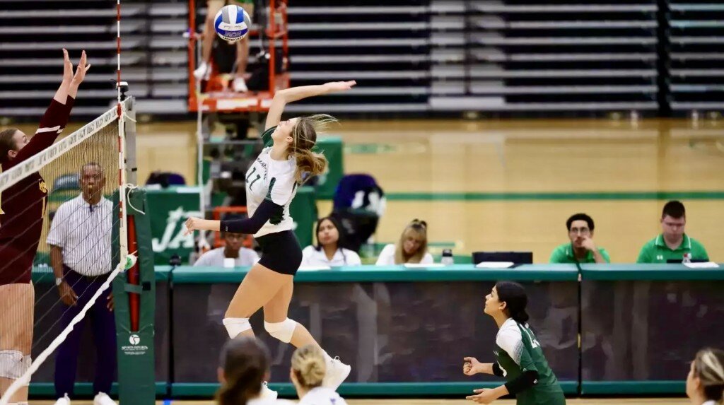 Abby Morreale, #11, who led her team last season in blocks, goes in for the kill.