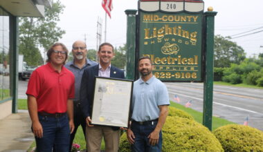 Assemblyman Slater presents the owners of Mid-Hudson Electric with a proclamation naming them to the New York State Historic Business Preservation Registry,
