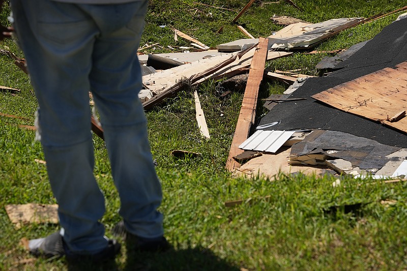 Wreckage from a tornado lies on the ground Friday, Aug. 21, 2026, in Dover, Del. (AP Photo/Mingson Lau)