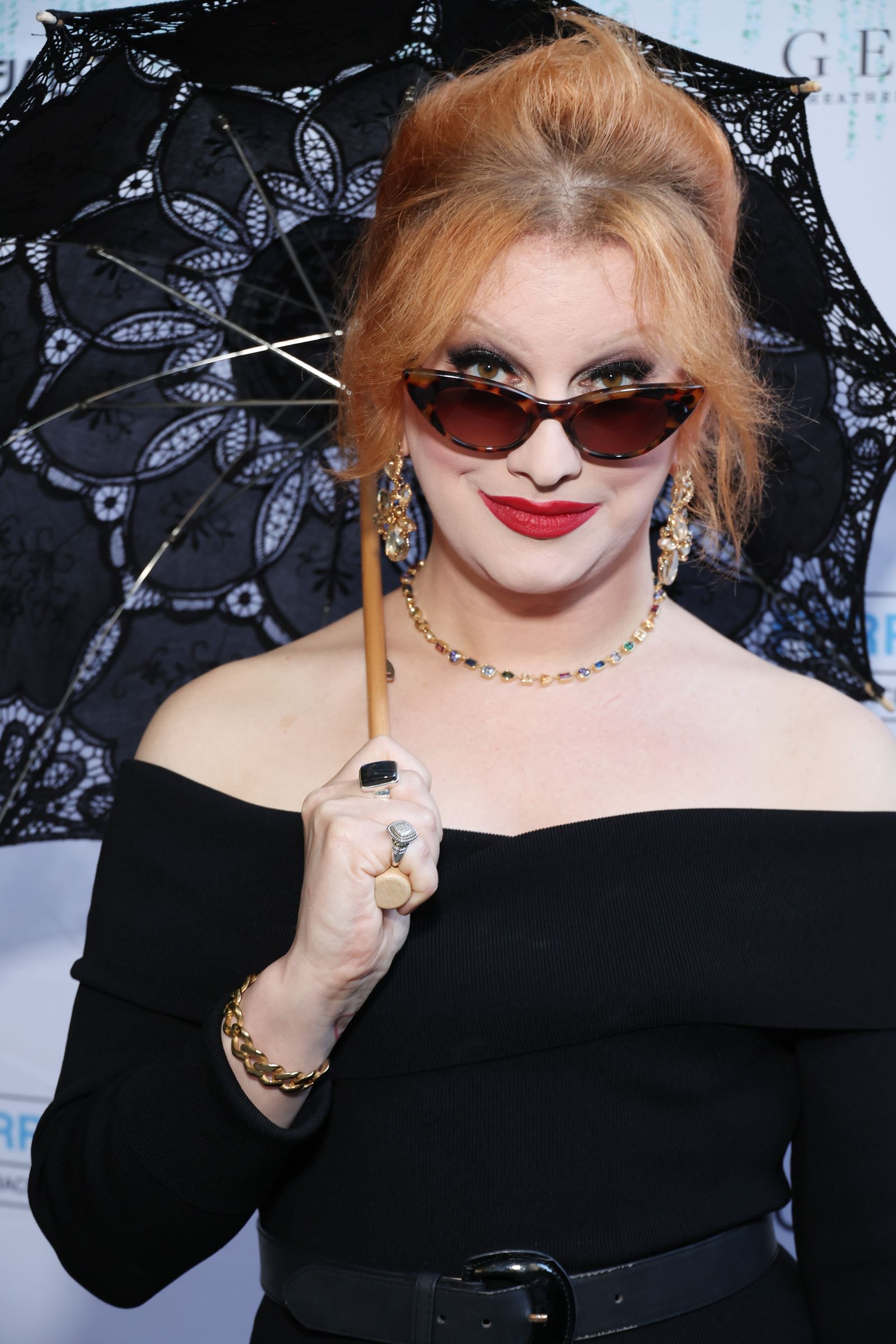Image may contain Jinkx Monsoon Accessories Sunglasses Face Head Person Photography Portrait Adult and Body Part