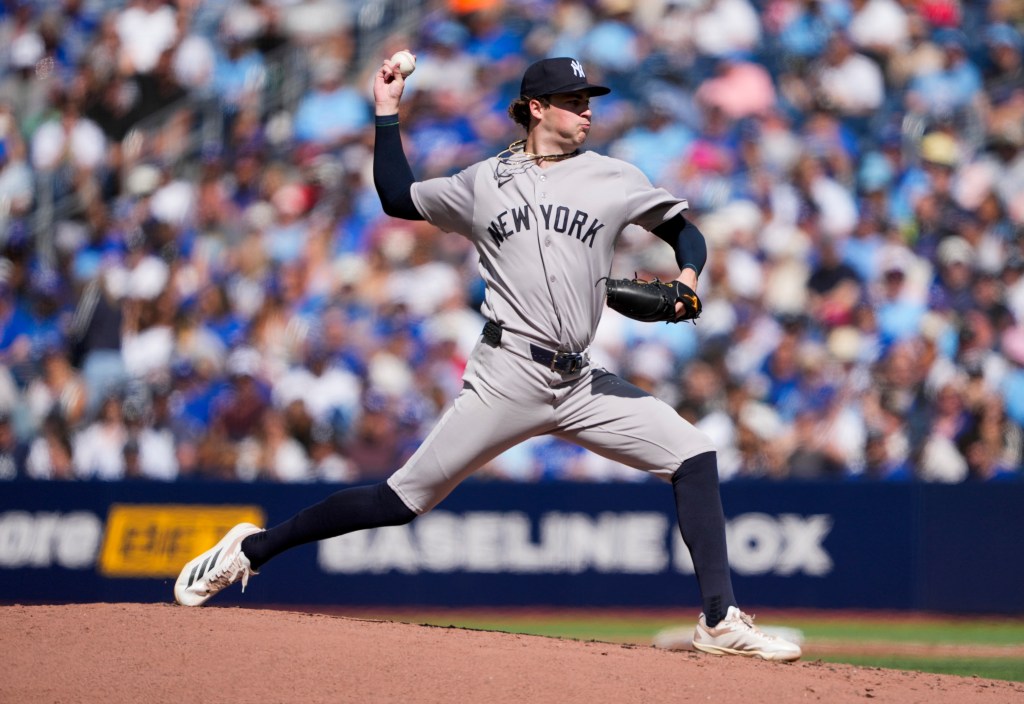 Cam Schlittler #31 of the New York Yankees pitches against the Toronto Blue Jays during the second inning in their MLB game at the Rogers Centre on August 15, 2026 in Toronto, Ontario, Canada. 