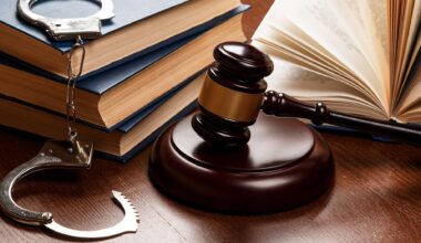 Stock image of gavel, handcuffs, and law books