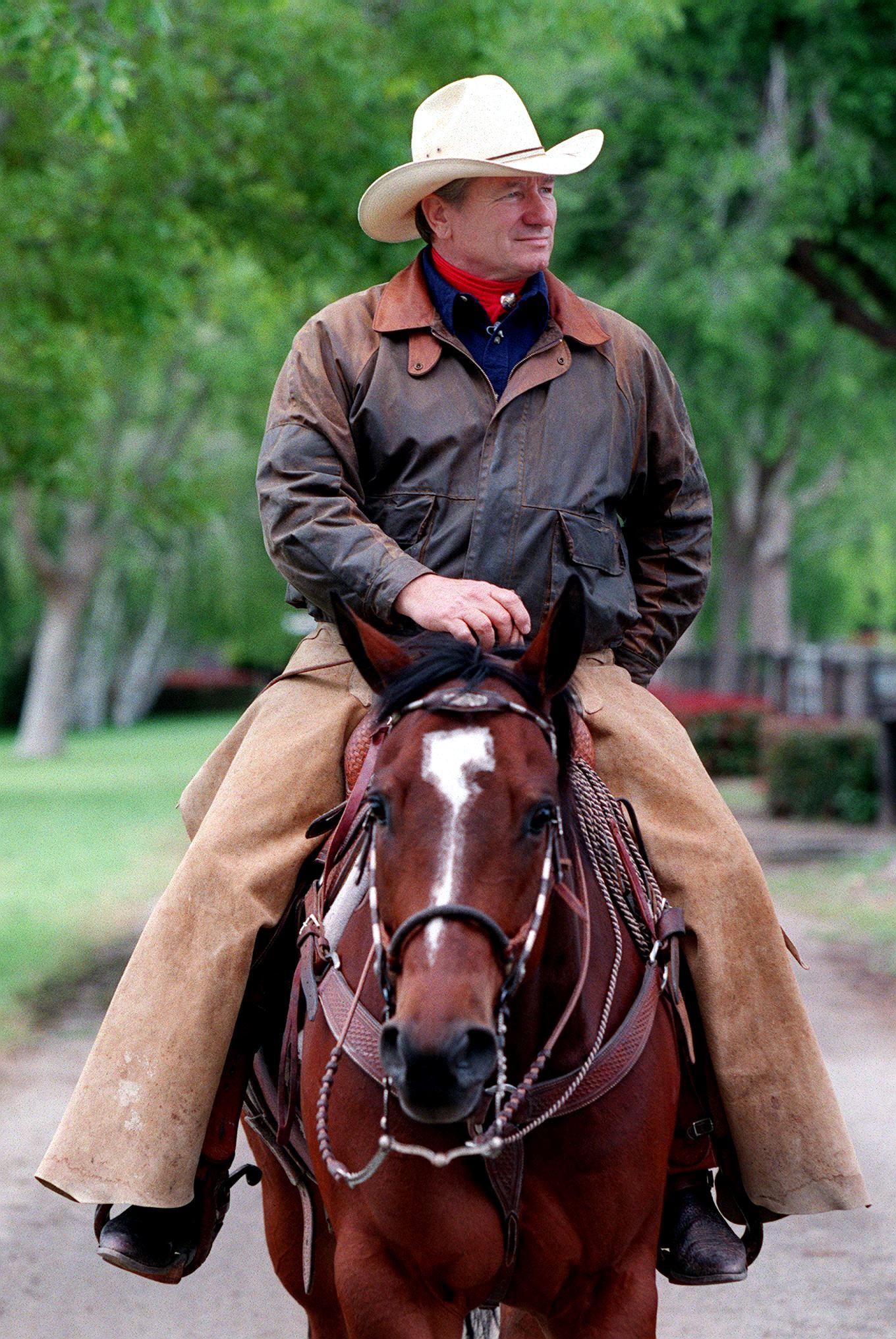 Monty Roberts on horseback at Flag is Up farm