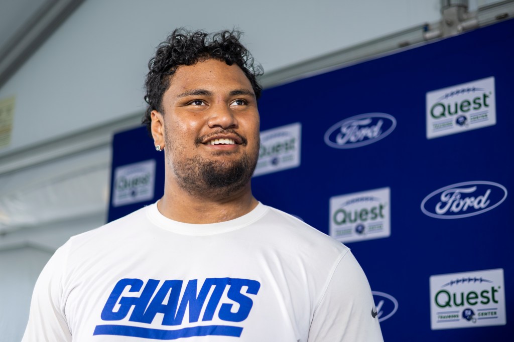 New York Giants' Francis Mauigoa (65) speaks with the media during training camp.