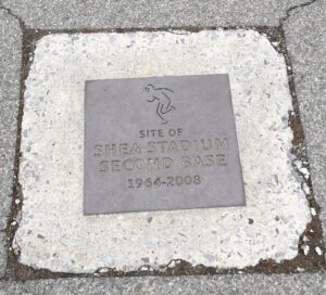 The Shea Stadium sec­ond base marker in the Citi Field parking lot. The stages for both con­certs were on second base. Photo: David Paone