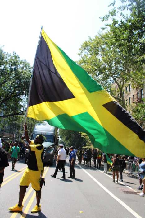 The largest Jamaican flag was waved by an enthusiastic reveler as he made his way along Ocean Avenue in Brooklyn on August 8 to show his love and patriotism for the island nation.