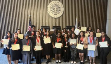 Hon. Ellen Edwards, center, alongside graduates of the Legal Outreach Summer Law Institute displaying their certificates of completion. Photo: Wayne Daren Schneiderman/Brooklyn Eagle