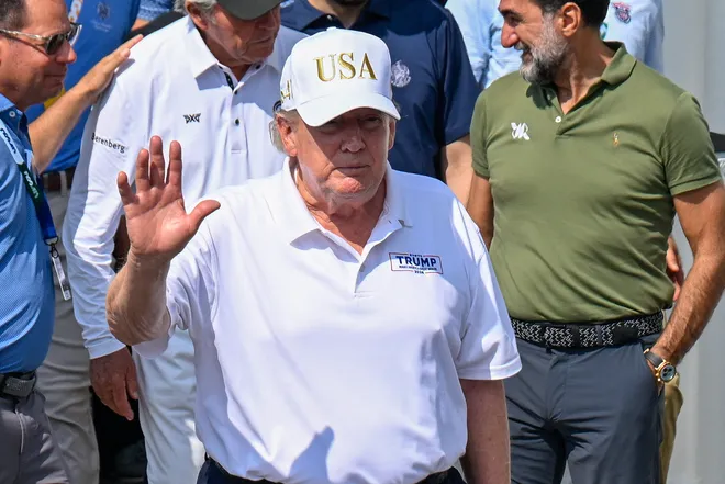 Donald Trump walks out of the clubhouse before the final round of the 2026 LIV Golf New York at Trump National Bedminster.